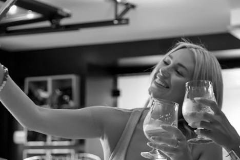 a woman holding a wine glass