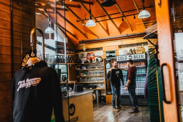 a person standing in front of a store